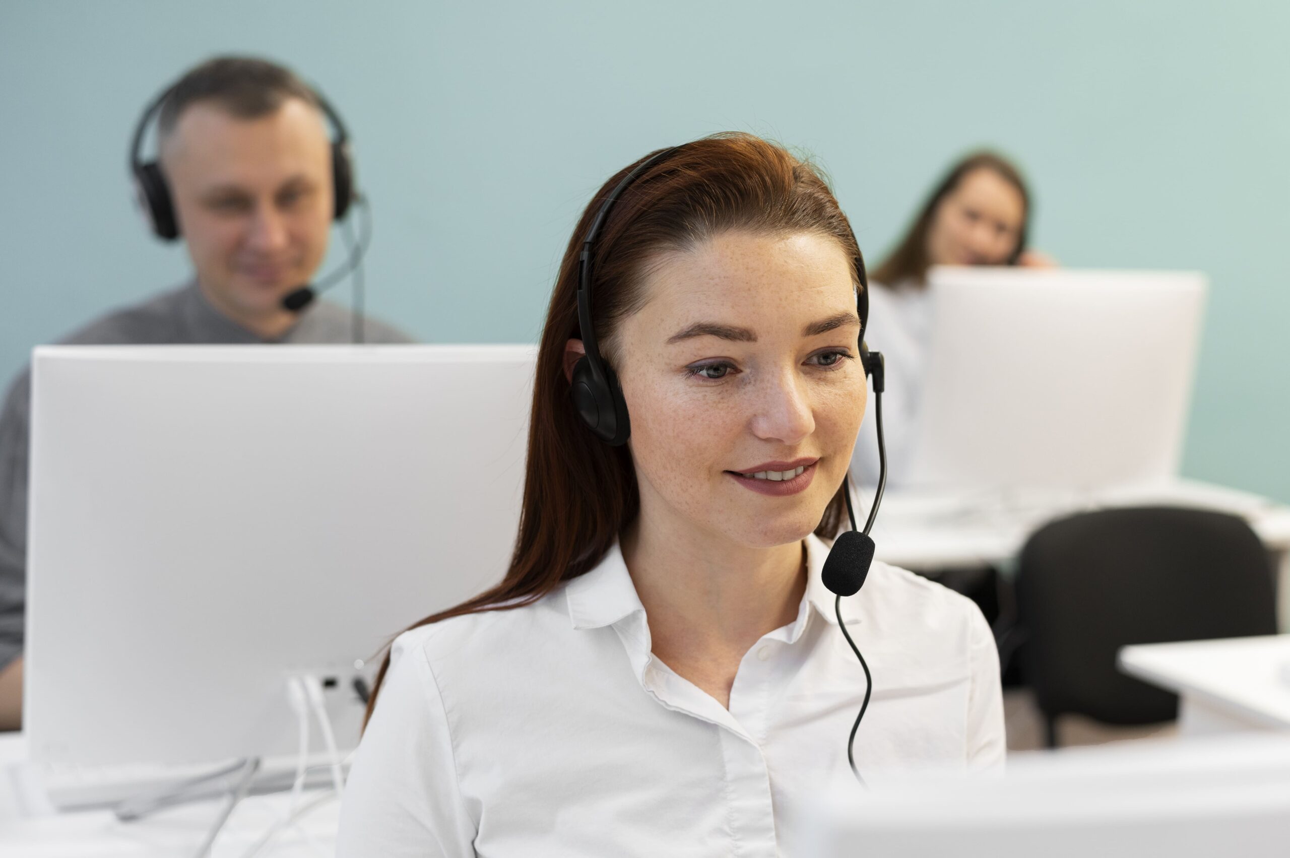 woman-working-call-center-office-with-headphones-computer (1)